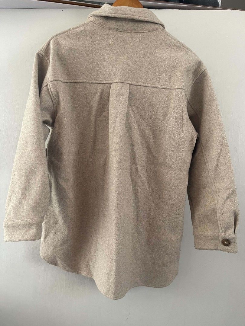 Zara Oversized Wool Blend Shacket Jacket Beige (Category: Coats, Jackets and Outerwear) located in Taguig. Submitted by thriftzzzy (Listing ID 1461673113, Image 3). Description: - Oversized shacket from Zara - Beige color - Two chest pockets - Button closures - Ideal for layering - Size S - Made in Myanmar.