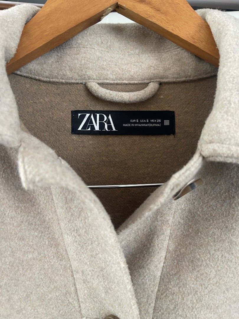 Zara Oversized Wool Blend Shacket Jacket Beige (Category: Coats, Jackets and Outerwear) located in Taguig. Submitted by thriftzzzy (Listing ID 1461673113, Image 2). Description: - Oversized shacket from Zara - Beige color - Two chest pockets - Button closures - Ideal for layering - Size S - Made in Myanmar.