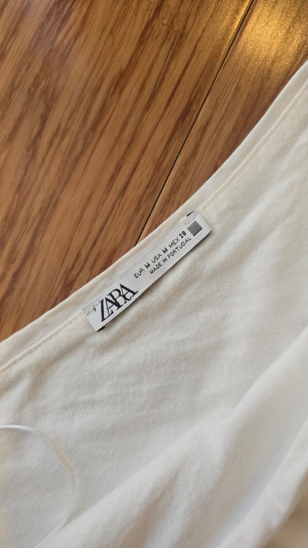 Zara White Eyelet Top with Tie Straps (Category: Sleeveless) located in Paranaque City. Submitted by monicaher (Listing ID 1461668737, Image 2). Description: has minimimal stain pls see last photo Cute white Zara top with eyelet hem and tie straps. Made in Portugal. Perfect for summer!.