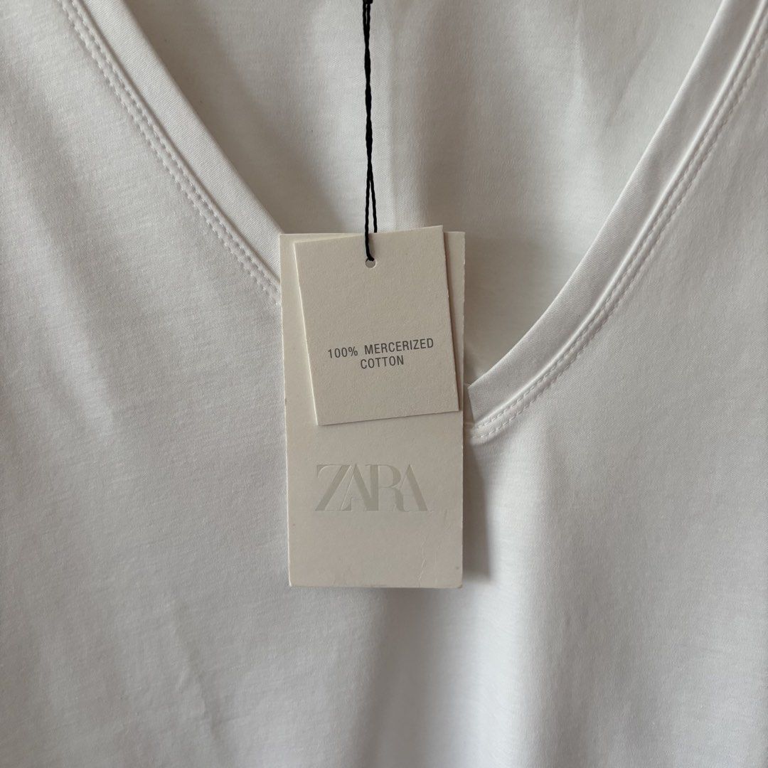 Zara White V-Neck (Category: Shirts) located in Quezon City. Submitted by dcoffeeholic (Listing ID 1461623783, Image 3). Description: Zara White V-neck Shirt 100% Mercerized Cotton Size: S RFS: Need a smaller size (I have narrow shoulders).
