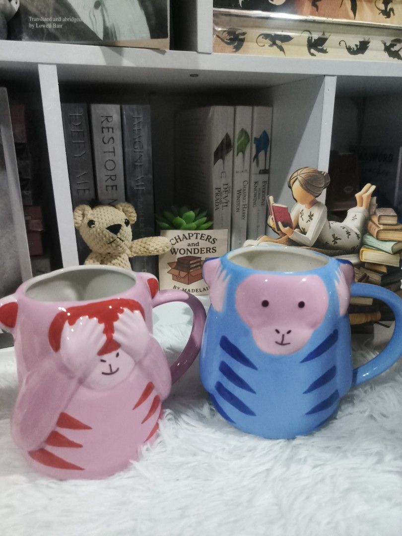 Zebra Denmark Monkey Mugs (Pink & Blue) (Category: Coffee & Tea Tableware) located in Cabuyao City. Submitted by chaptersandwonders143 (Listing ID 1461715272, Image 1). Description: - Adorable monkey design from Zebra Denmark - Available in two fun colors: pink and blue - Ideal for enjoying your favorite coffee or tea - Suitable for both kids and adults - Made in China - Makes a fantastic gift or a cheerful addition to your kitchen.