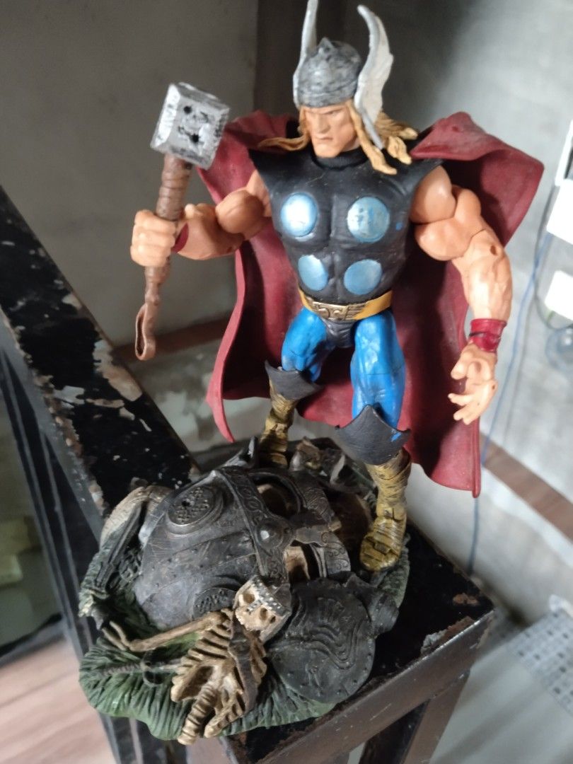 2001 Marvel Thor Action Figure with Mjolnir and Diorama Base (Category: Figurines & Statues) located in Manila. Submitted by megazordbuilderhunter (Listing ID 1461845633, Image 2). Description: - Vintage 2001 Marvel Thor action figure - Includes Mjolnir accessory - Features a detailed diorama base with a skeleton - Perfect for collectors - Made in China.