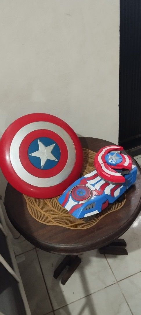 2016 Captain America Weaponry Set (Category: Western Merchandise) located in Manila. Submitted by ventajetoyz625 (Listing ID 1461828544, Image 2). Description: - Authentic Captain America Shield & Gauntlet Set - Ideal for any Marvel fan or collector - Shield: untested gimmick; with scratches - Gauntlet: working condition; missing rubber bullets - What you see is what you get .