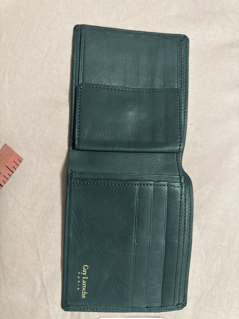 2027 Guy Laroche Paris Leather Bifold Wallet (Category: Wallets & Card holders) located in Silang. Submitted by sari2bilina (Listing ID 1461842407, Image 3). Description: - Genuine dark green leather bifold wallet from Guy Laroche Paris. - Ample card slots for all your essentials. - Includes a convenient coin pouch. - Compact size: approximately 4.5 inches by 3.5 inches when closed. - Perfect for everyday carry and use..