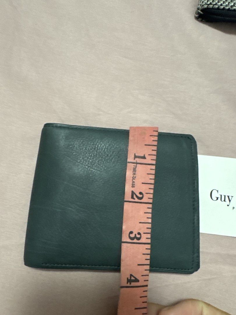 2027 Guy Laroche Paris Leather Bifold Wallet (Category: Wallets & Card holders) located in Silang. Submitted by sari2bilina (Listing ID 1461842407, Image 2). Description: - Genuine dark green leather bifold wallet from Guy Laroche Paris. - Ample card slots for all your essentials. - Includes a convenient coin pouch. - Compact size: approximately 4.5 inches by 3.5 inches when closed. - Perfect for everyday carry and use..