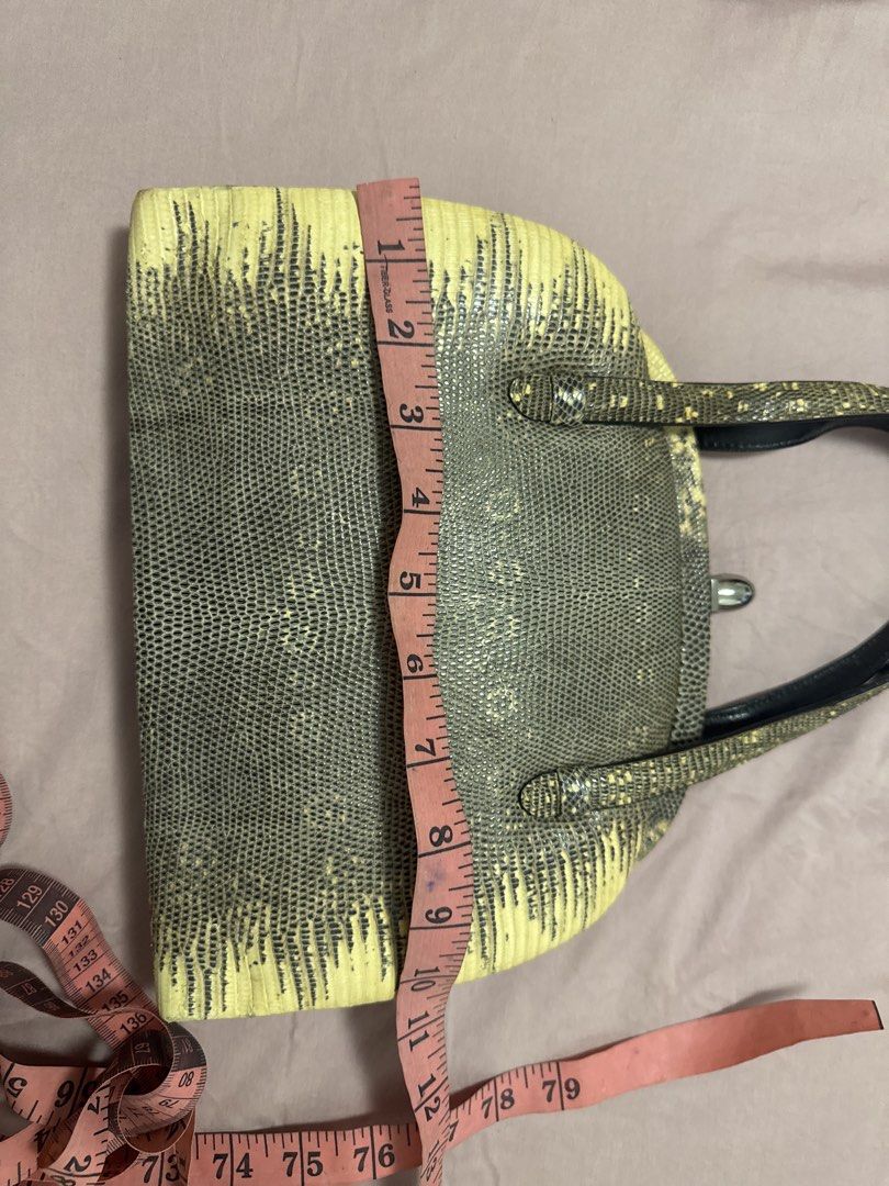 2027 Vintage Lizard Print Top Handle Bag (Category: Luxury Bags & Wallets) located in Silang. Submitted by sari2bilina (Listing ID 1461830666, Image 2). Description: - Unique vintage handbag - Lizard print exterior - Color: Mix of yellow and grey - Structured shape - Clasp closure - Interior: 1 zippered pocket, 1 slip pocket - Black handles - Approximate measurements: 8 inches tall, 11 inches wide flaws shown last 2 pics ( need dikitan).