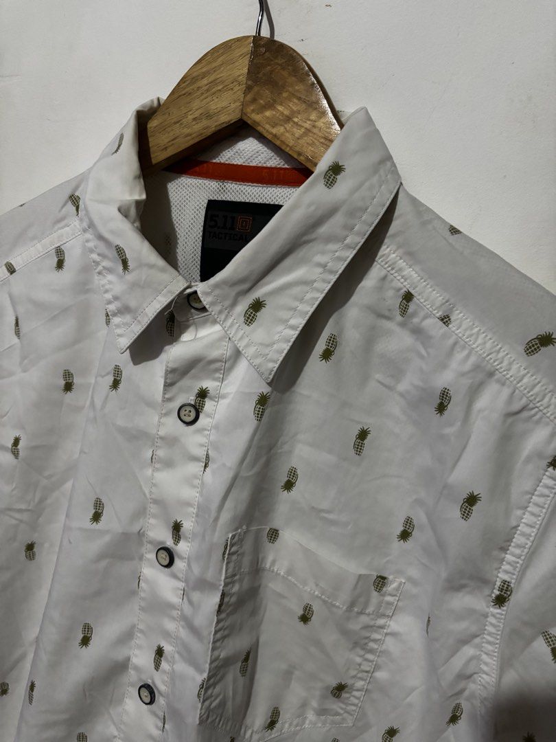 5.11 Tactical Pineapple Print Short Sleeve Button Up Shirt Medium (Category: Tshirts & Polo Shirts ) located in Subic. Submitted by thriftpoison (Listing ID 1461928248, Image 2). Description: - Brand: 5.11 Tactical - Color: White - Sleeve Length: Short Sleeve - Style: Button Up Shirt - Size: Medium - Length 29 Width 23 - Features: All-over pineapple print, classic collar, button front, chest pocket - Occasion: Casual wear, vacation - Has minimal 
