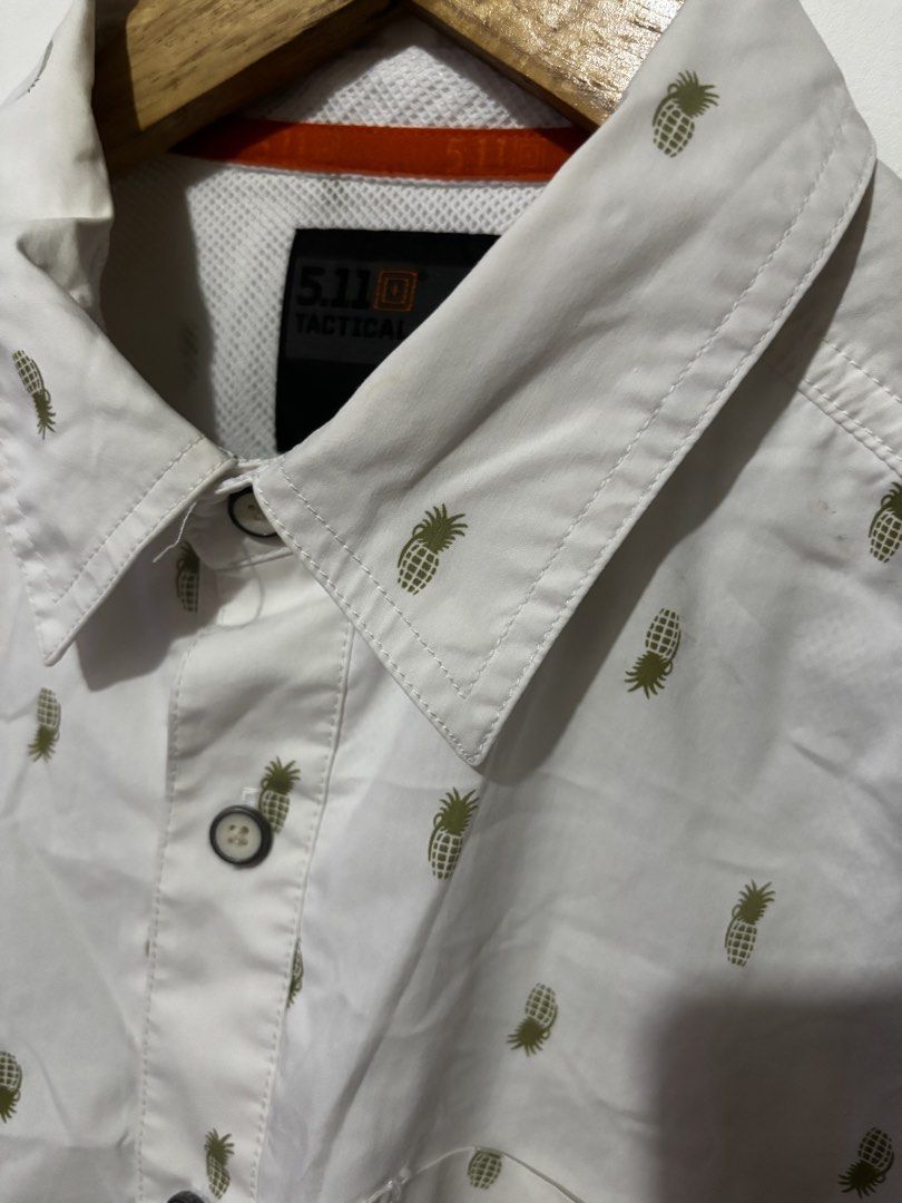 5.11 Tactical Pineapple Print Short Sleeve Button Up Shirt Medium (Category: Tshirts & Polo Shirts ) located in Subic. Submitted by thriftpoison (Listing ID 1461928248, Image 3). Description: - Brand: 5.11 Tactical - Color: White - Sleeve Length: Short Sleeve - Style: Button Up Shirt - Size: Medium - Length 29 Width 23 - Features: All-over pineapple print, classic collar, button front, chest pocket - Occasion: Casual wear, vacation - Has minimal 