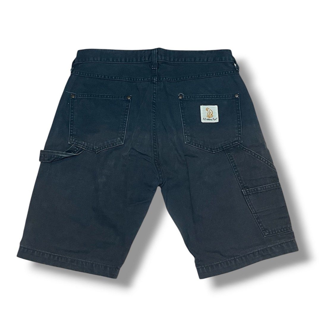 A Bathing Ape BAPE Carpenter Shorts (Category: Shorts) located in Manila. Submitted by jstash09 (Listing ID 1461955819, Image 2). Description: - Dark grey BAPE carpenter shorts - Classic BAPE logo tag on front waistband - Small logo patch on back pocket - Utility style with hammer loop on the side - Size S - Great for casual wear -Fits 30-32 x 20” .