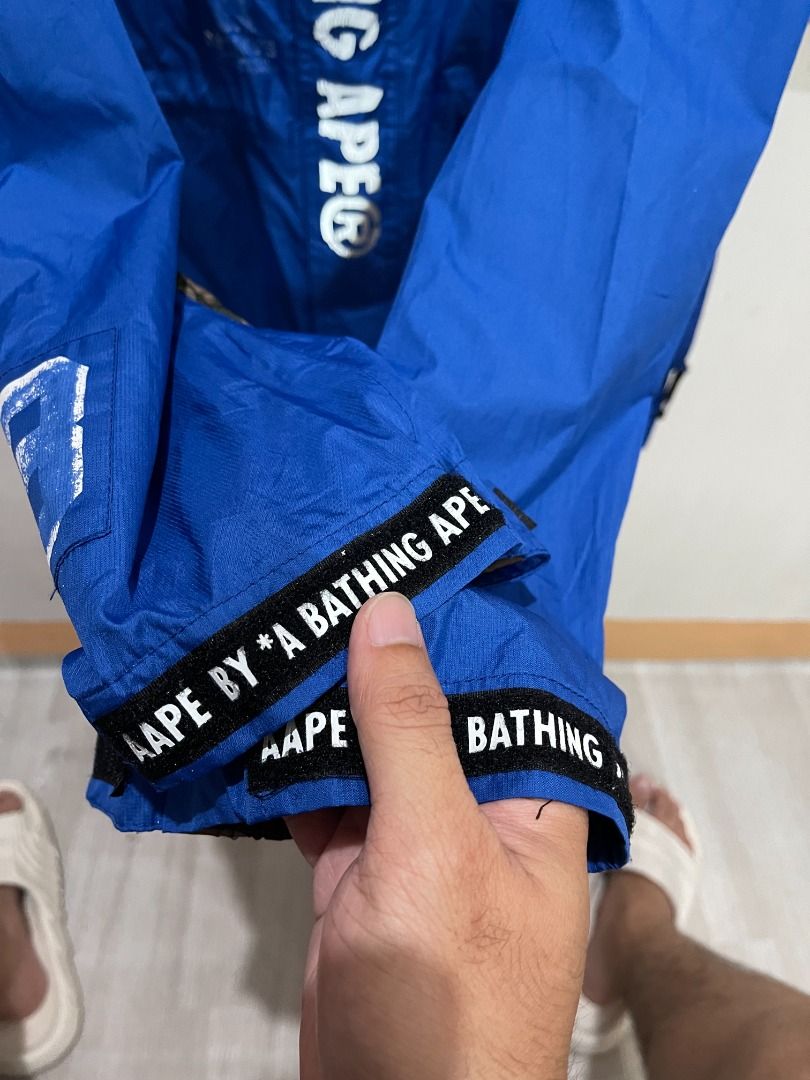AUTHENTIC AAPE BY A BATHING APE 'BLUE CAMO' WINDBREAKER JACKET (Category: Coats, Jackets and Outerwear) located in Manila. Submitted by ako.si.lemmor (Listing ID 1461849053, Image 3). Description: This item is authentic but thrifted, manage your expectation. Dimes: 21X27.5 (L-XL) Color rate: 8/10 Issue: Print cracks and fades, cleaning, peeled off interior tapes Ship at your own cost or pickup Mandaluyong..