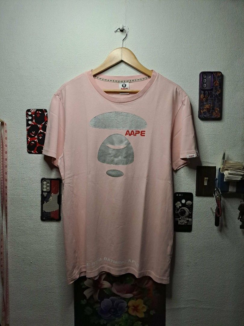 Aape Mad Face (Category: Tshirts & Polo Shirts ) located in Quezon City. Submitted by yaseen73 (Listing ID 1461909808, Image 1). Description: Aape Universe Mad Face Baby Pink With Cracks on Print and Single Pinhole Wearing Size : L - XL Dimensions : See Photo Color Rate : 9.5/10 - Pre Owned MOP : G C A S H B A N K T R A N S F E R COURIER : J & T LALAMOVE seller's location: 📍Brgy. Pansol, Q.C.