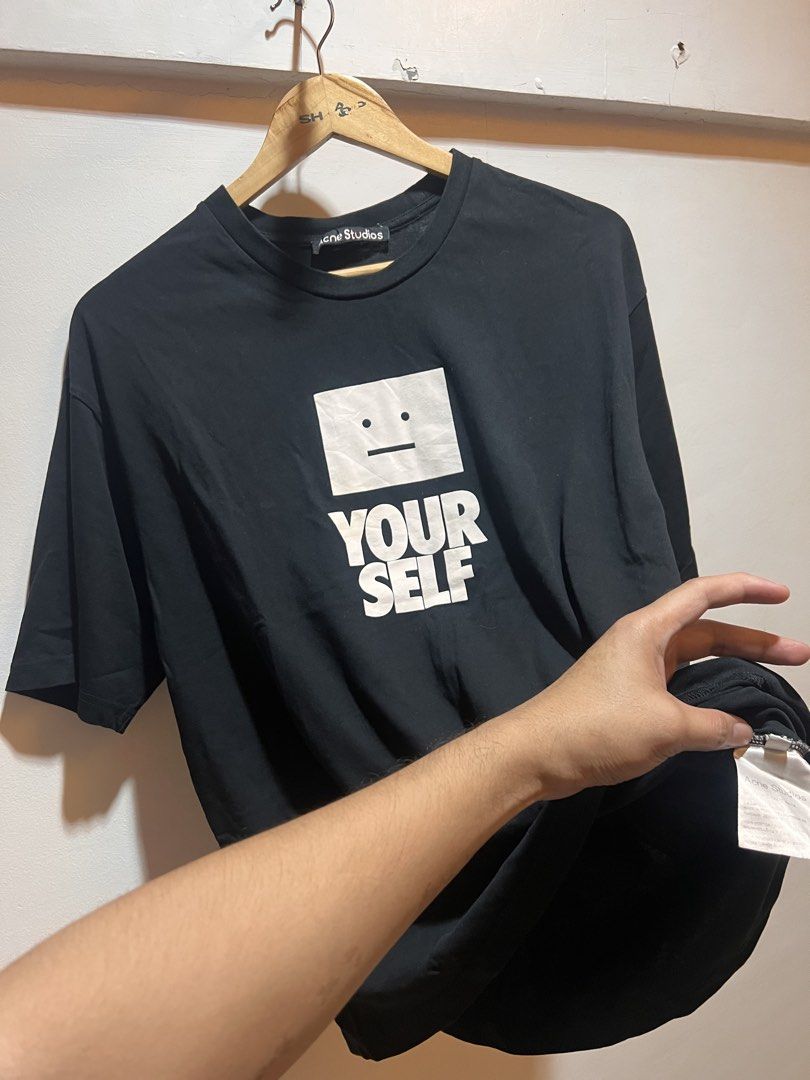Acne Studios Black "YOUR SELF" Graphic T-Shirt (Category: Tshirts & Polo Shirts ) located in San Juan, La Union. Submitted by jeggystyle (Listing ID 1461964725, Image 1). Description: - Acne Studios black t-shirt - Features 'YOUR SELF' graphic print on the front - Classic crew neck and short sleeves - Plain black on the back - Made from good quality cotton - Ideal for everyday casual wear.