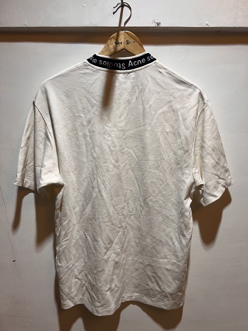 Acne Studios White T-shirt with Logo Neckline (Category: Tshirts & Polo Shirts ) located in San Juan, La Union. Submitted by jeggystyle (Listing ID 1461963547, Image 3). Description: - Authentic Acne Studios white t-shirt - Features signature brand name on the neckline - Classic short sleeves - Designed for a comfortable, relaxed fit - Ideal for everyday casual wear Fits large.