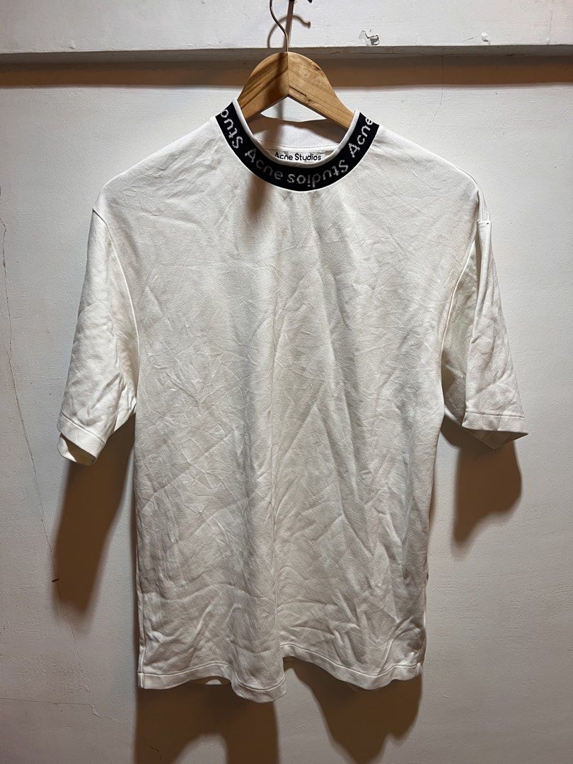 Acne Studios White T-shirt with Logo Neckline (Category: Tshirts & Polo Shirts ) located in San Juan, La Union. Submitted by jeggystyle (Listing ID 1461963547, Image 1). Description: - Authentic Acne Studios white t-shirt - Features signature brand name on the neckline - Classic short sleeves - Designed for a comfortable, relaxed fit - Ideal for everyday casual wear Fits large.