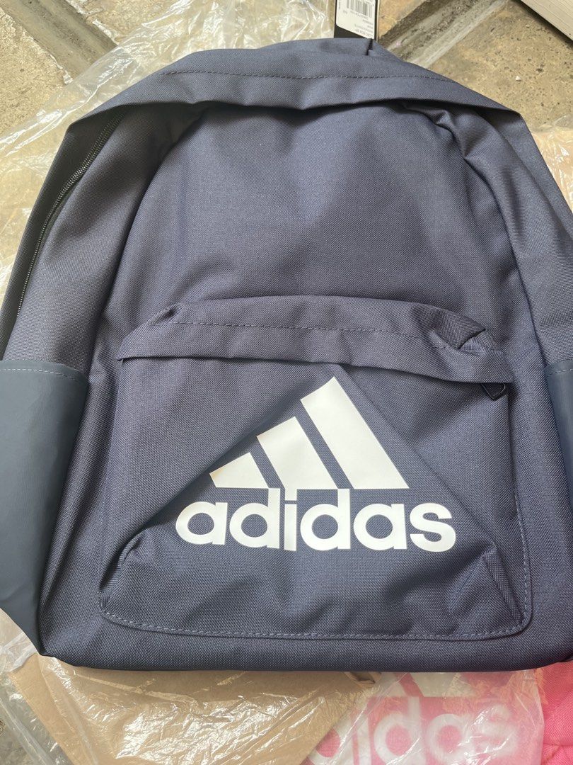 Adidas Backpack Navy Blue (Category: Backpacks) located in Pasig City. Submitted by melaiski28 (Listing ID 1461820143, Image 1). Description: - Navy blue Adidas backpack - Classic Adidas logo on front - Adjustable straps for comfort - Main compartment - Front zip pocket - Side pockets - Still has tags attached - Ideal for school or everyday use.