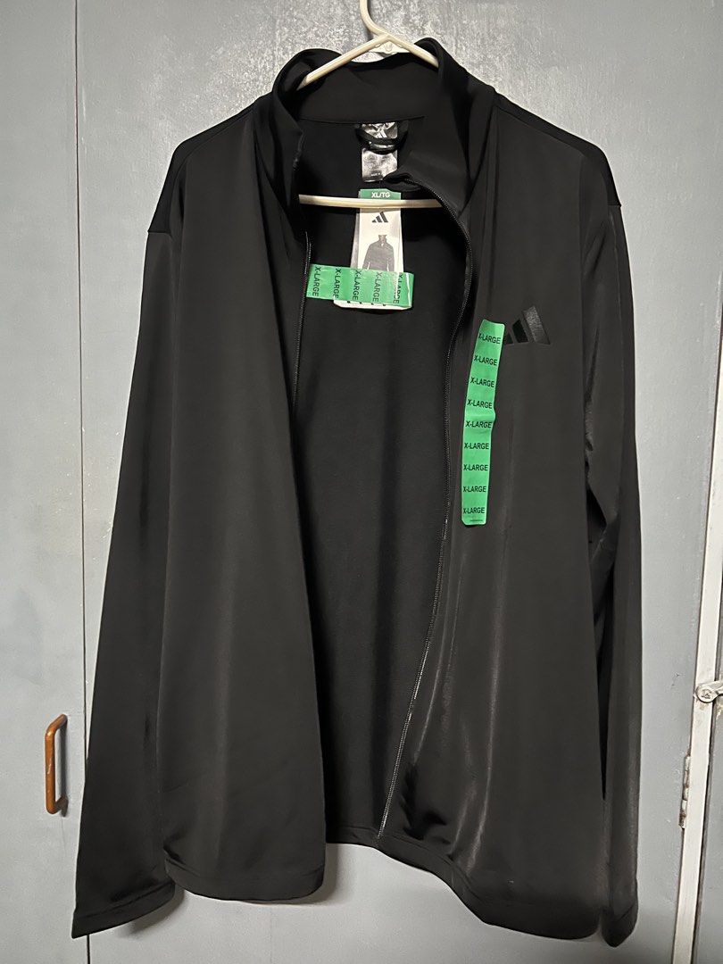 Adidas Black Full Zip Track Jacket XL (Category: Coats, Jackets and Outerwear) located in Makati City. Submitted by cctgsupplyxo (Listing ID 1461971367, Image 3). Description: RFS: not my brother’s size Dimensions Chest 52 inches length 29 inches Shoulder 20 inches Arm hole 22 inches - Black Adidas track jacket - Adidas embroidered logo on chest - Size XL - Ideal for workouts or casual wear Issues: - slight run below the adidas logo.