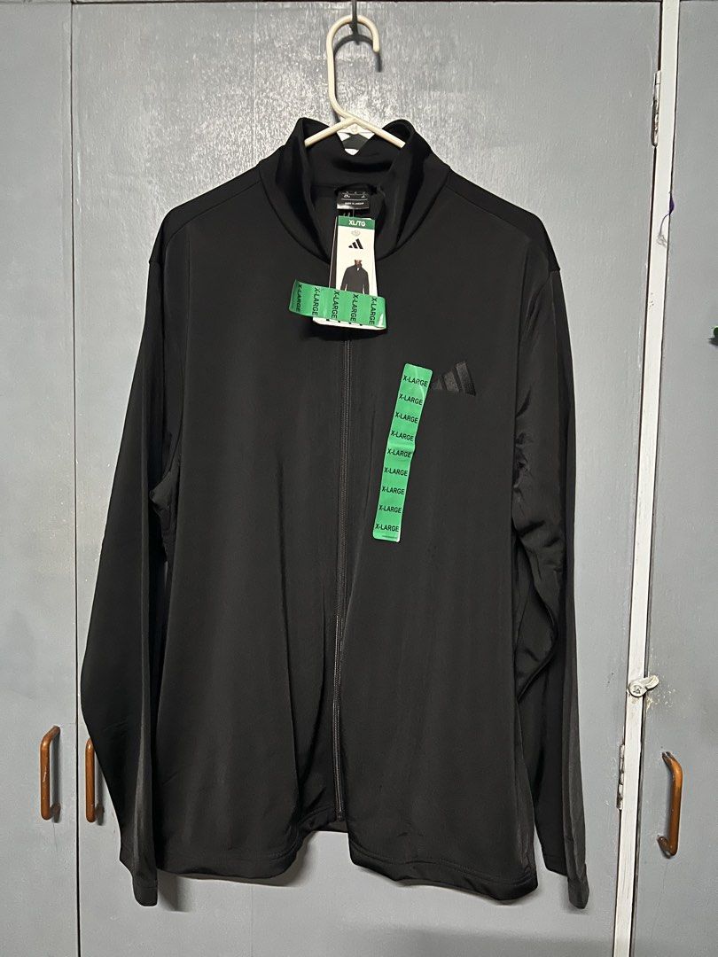 Adidas Black Full Zip Track Jacket XL (Category: Coats, Jackets and Outerwear) located in Makati City. Submitted by cctgsupplyxo (Listing ID 1461971367, Image 1). Description: RFS: not my brother’s size Dimensions Chest 52 inches length 29 inches Shoulder 20 inches Arm hole 22 inches - Black Adidas track jacket - Adidas embroidered logo on chest - Size XL - Ideal for workouts or casual wear Issues: - slight run below the adidas logo.