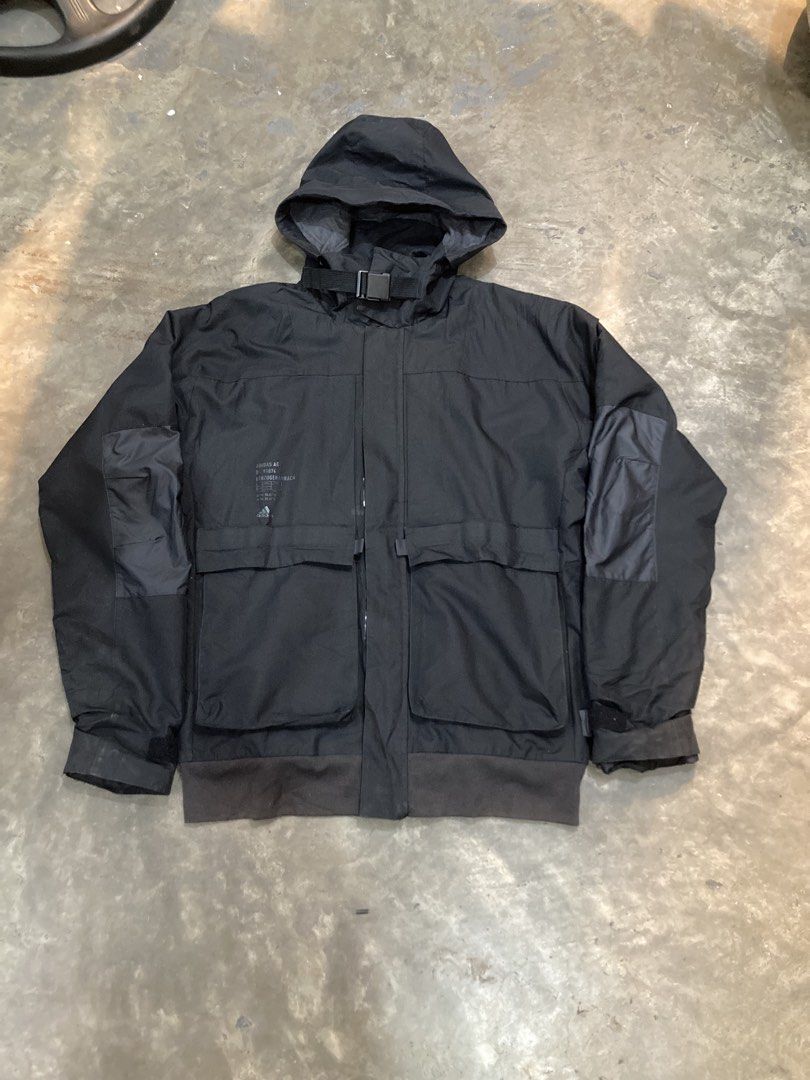 Adidas Black Hooded Jacket (Category: Coats, Jackets and Outerwear) located in Trece Martires City. Submitted by thriftkoto.91 (Listing ID 1461924863, Image 1). Description: - Black Adidas jacket - Hooded design - Multiple front pockets - Adjustable hood and sleeve straps - Zipper closure - Ideal for outdoor activities and casual wear.