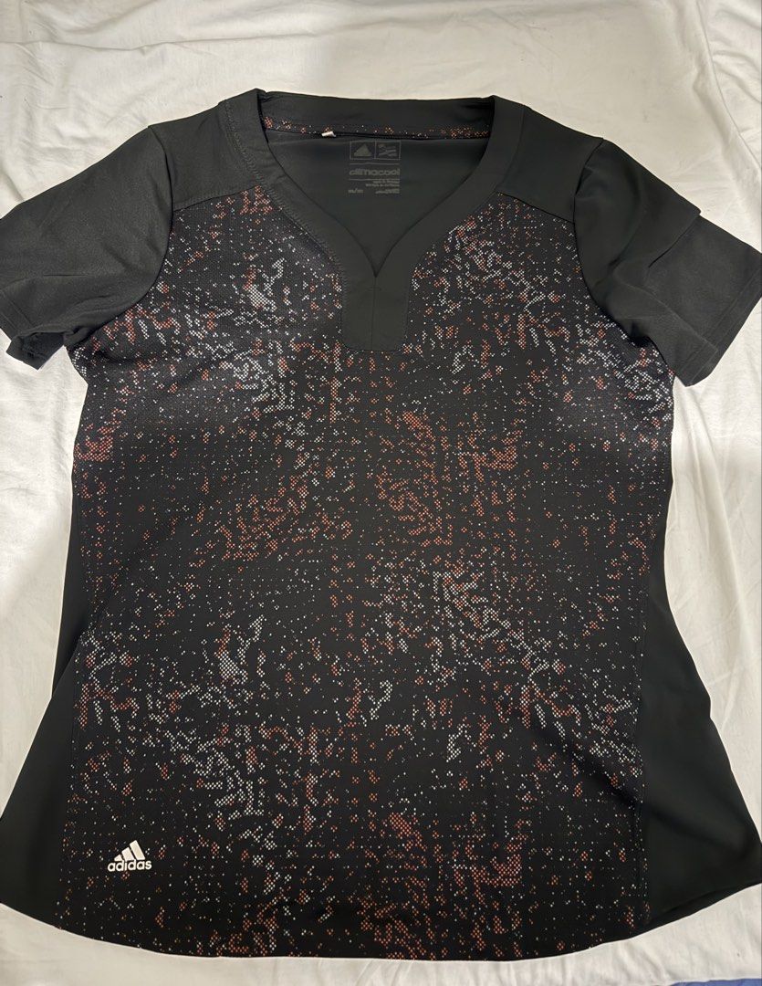 Adidas ClimaCool Athletic T-shirt (Category: Activewear) located in Makati City. Submitted by malcolmkenji (Listing ID 1461894987, Image 1). Description: - Black Adidas V-neck t-shirt - Features a cool abstract pattern - ClimaCool technology for enhanced breathability - Short sleeves - Ideal for workouts or casual outings - Adidas logo on the bottom left.