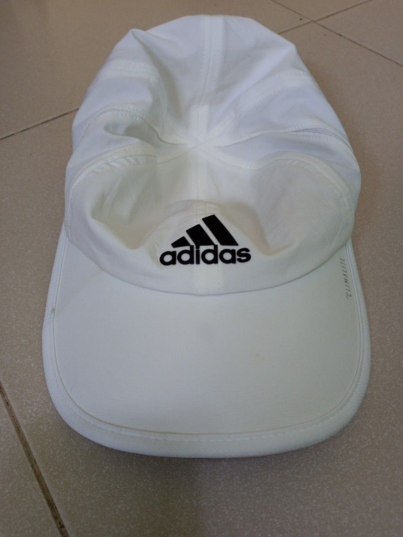 Adidas Climalite White Cap (Category: Caps & Hats) located in Manila. Submitted by onewikstraight (Listing ID 1461837398, Image 1). Description: - Classic white Adidas cap - Features iconic Adidas logo - Climalite technology for enhanced breathability - Adjustable strap for a customized fit - Made with 87% polyester, 13% spandex - Ideal for sports activities or casual outings 500+sf.