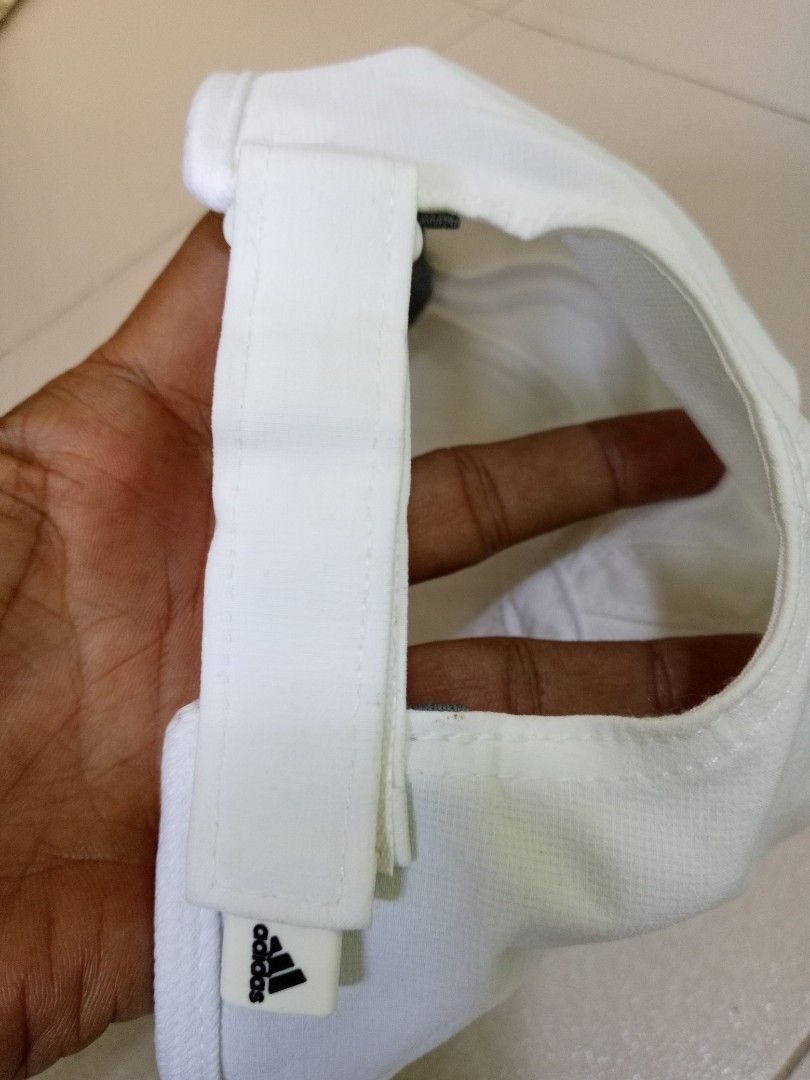 Adidas Climalite White Cap (Category: Caps & Hats) located in Manila. Submitted by onewikstraight (Listing ID 1461837398, Image 2). Description: - Classic white Adidas cap - Features iconic Adidas logo - Climalite technology for enhanced breathability - Adjustable strap for a customized fit - Made with 87% polyester, 13% spandex - Ideal for sports activities or casual outings 500+sf.