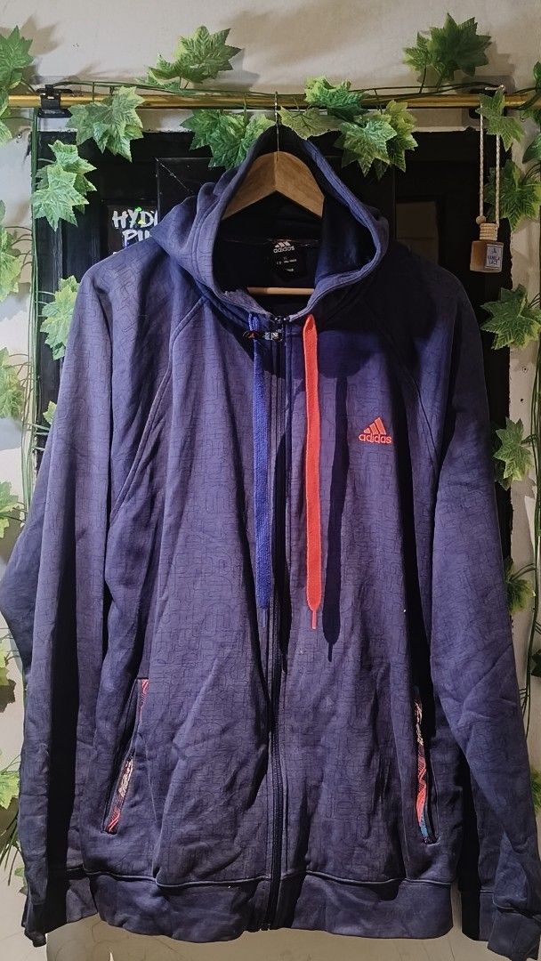 Adidas Full Zip Hoodie Jacket (Category: Coats, Jackets and Outerwear) located in Manila. Submitted by moneyroll420 (Listing ID 1461801186, Image 1). Description: - Navy blue Adidas hoodie - Subtle all-over pattern - Bright orange and blue drawstrings - Full zip closure - Convenient pockets - Ideal for casual outings or workouts.