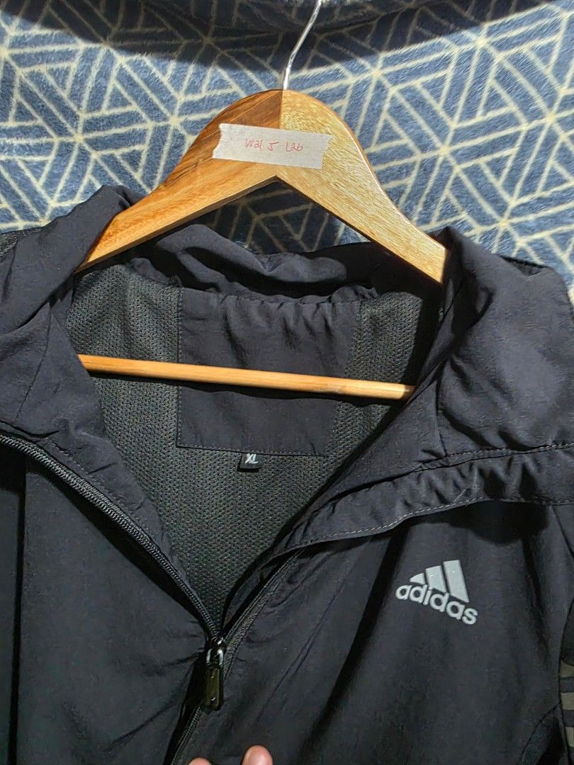 Adidas Jacket with 3 Stripes (Category: Coats, Jackets and Outerwear) located in Quezon City. Submitted by kick_mnl (Listing ID 1461866972, Image 2). Description: - Dark grey Adidas jacket - Classic 3 stripes on sleeves - Zippered pockets - Size XL - Great for sports or casual wear.