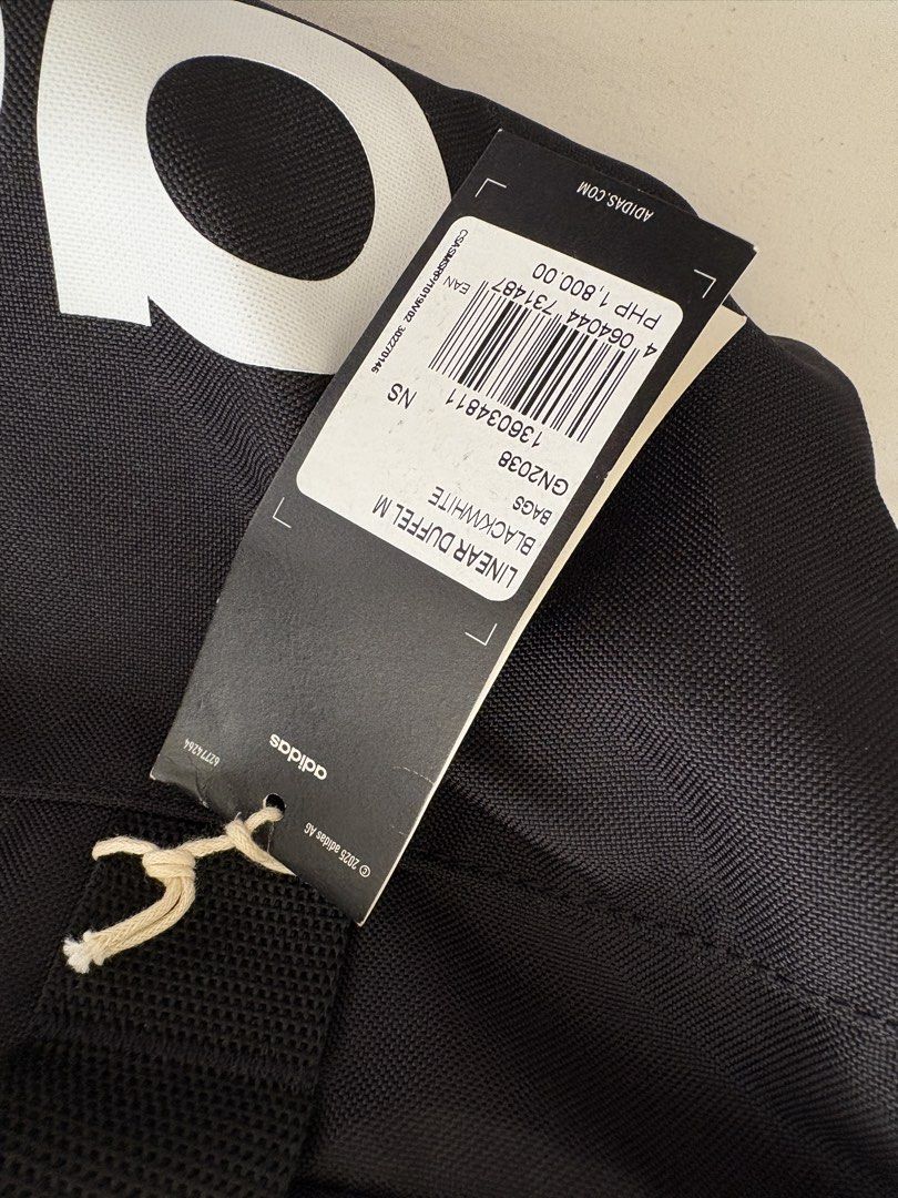 Adidas Linear Duffel M Black White Bag (Category: Sling Bags) located in Quezon City. Submitted by kumiebearrie (Listing ID 1461875131, Image 2). Description: Brand new adidas gym bag size medium Has 2 side pockets, Spacious In very good condition :) Original, with tag Rfs: too big for me 🙆‍♀️.