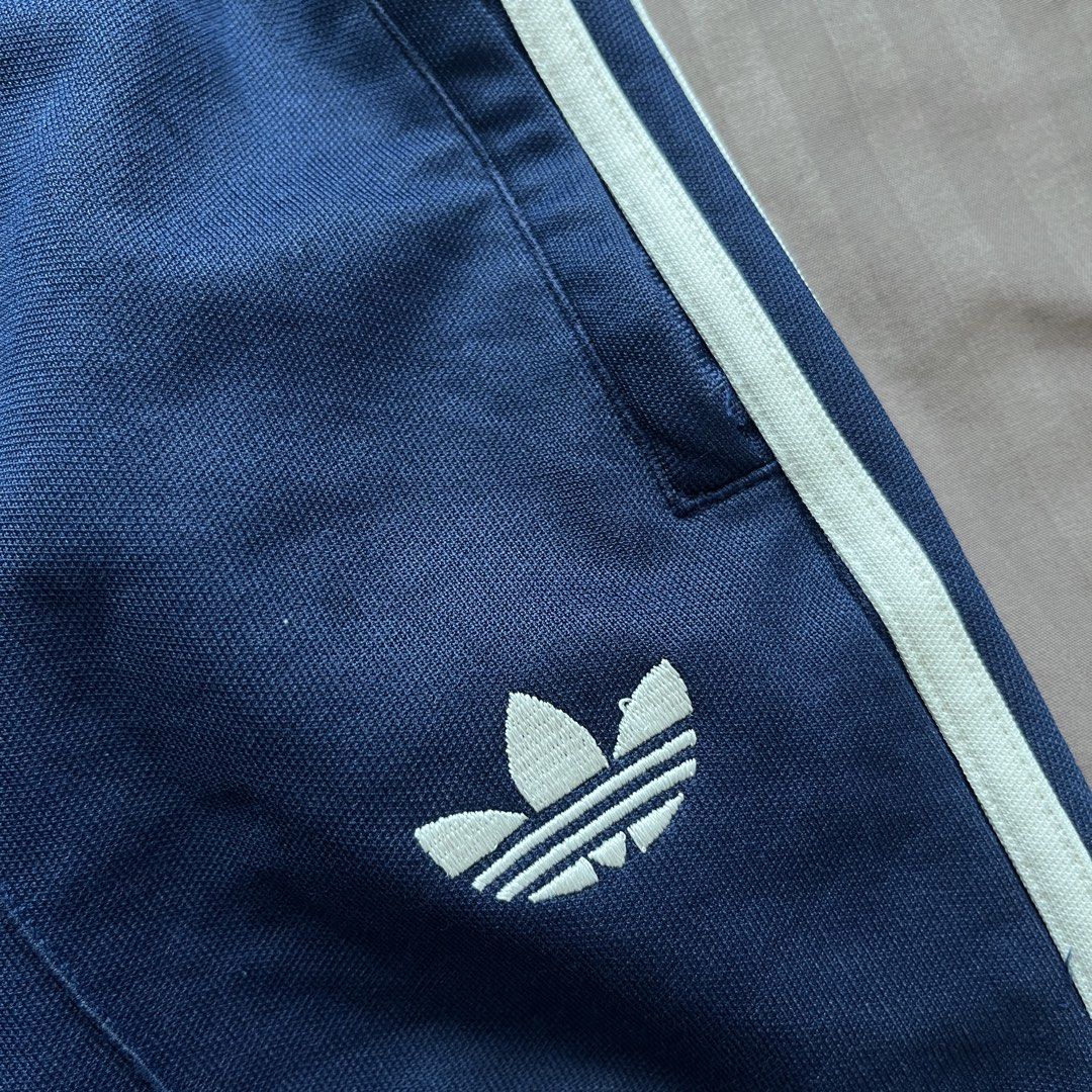 Adidas Navy Blue 3-Stripes Shorts (Category: Shorts) located in Cagayan de Oro. Submitted by aeiith (Listing ID 1462032655, Image 2). Description: - Navy blue Adidas shorts - Classic 3-stripes design on sides - Elastic waistband with drawstring for adjustable fit - Small Adidas logo on left leg - Ideal for casual wear or sports activities.