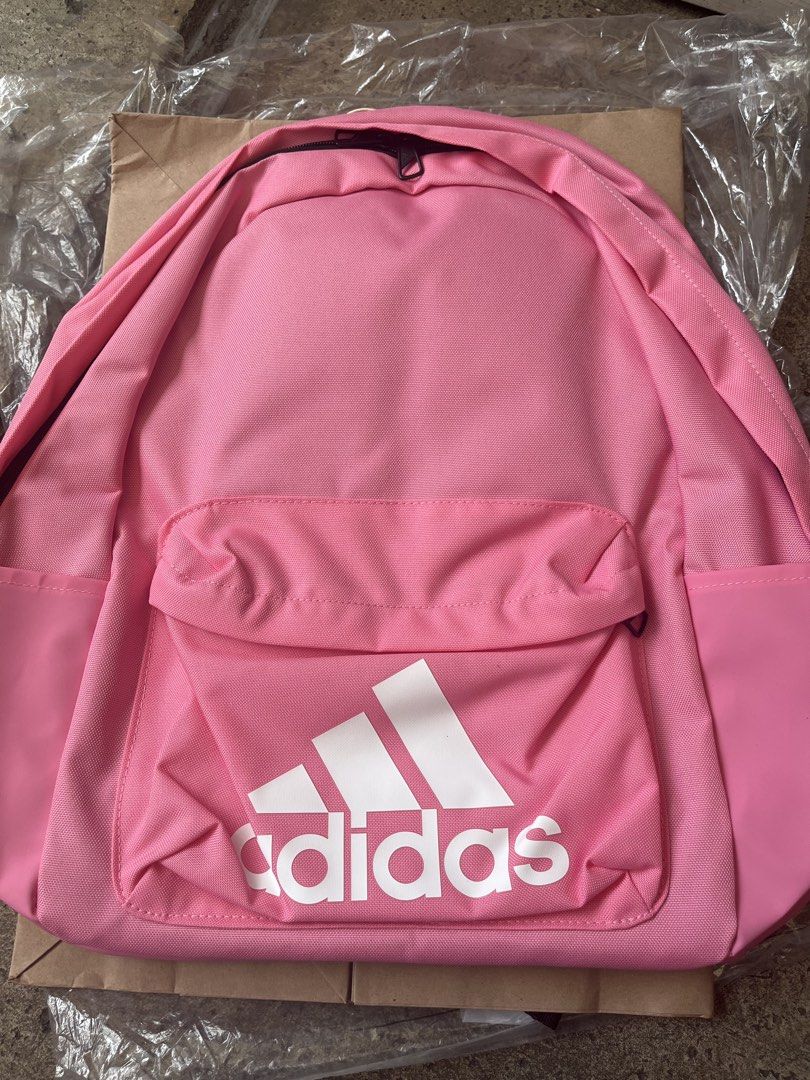 Adidas Pink Backpack (Category: Backpacks) located in Pasig City. Submitted by melaiski28 (Listing ID 1461820179, Image 2). Description: - Brand new pink Adidas backpack - Still has original tags attached - Features a front pocket with the iconic Adidas logo - Convenient side pockets for extra storage - Padded shoulder straps for maximum comfort - Ideal for school, gym, or everyday adventures.