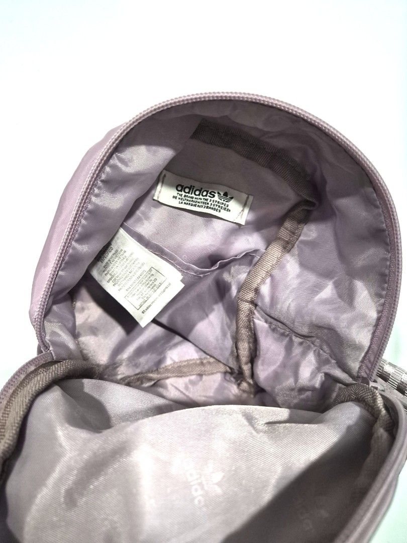 Free Adidas Purple Mini Sling Bag (Category: Sling Bags) located in Antipolo. Submitted by saribymonica (Listing ID 1461834015, Image 3). Description: - Authentic Cute purple Adidas mini bag - Main zippered compartment - Front pocket - Perfect for carrying essentials - Great for everyday use - No straps.
