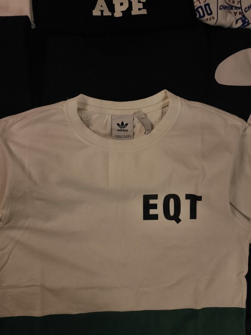 Adidas White Tee "EQT" (Category: Tshirts & Polo Shirts ) located in San Fernando. Submitted by gaboo_asncn (Listing ID 1462000429, Image 3). Description: - Adidas White Tee "EQT - Size: Small on tag ( W19.5/L27.5) - Condition: Excellent - Color Rate: 9/10 - No issue.