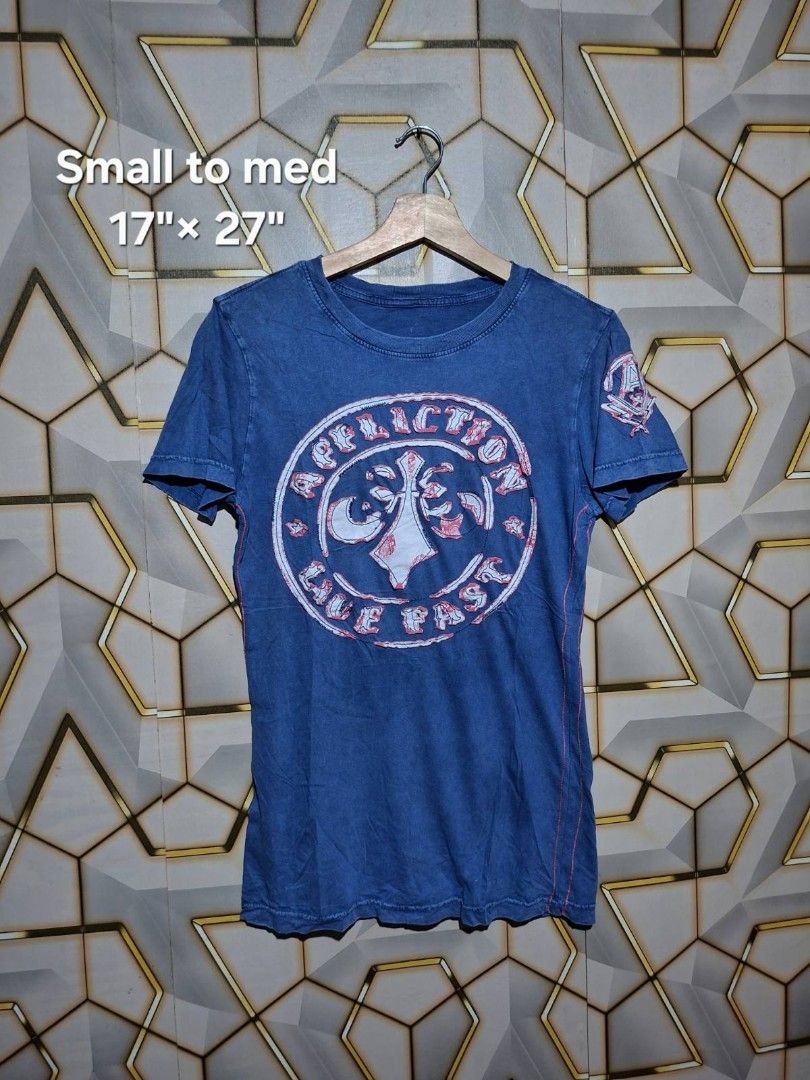 Affliction Blue Graphic T-Shirt (Category: Shirts) located in Tagaytay City. Submitted by joyjavier1230 (Listing ID 1462029231, Image 1). Description: Affliction graphic t-shirt in excellent condition no issues 9.5/10 color rate small to medium width:17" length:27" 300+shipping fee location: Tagaytay shipping via jnt mop: gcash dm to purchase 📩📩📩.