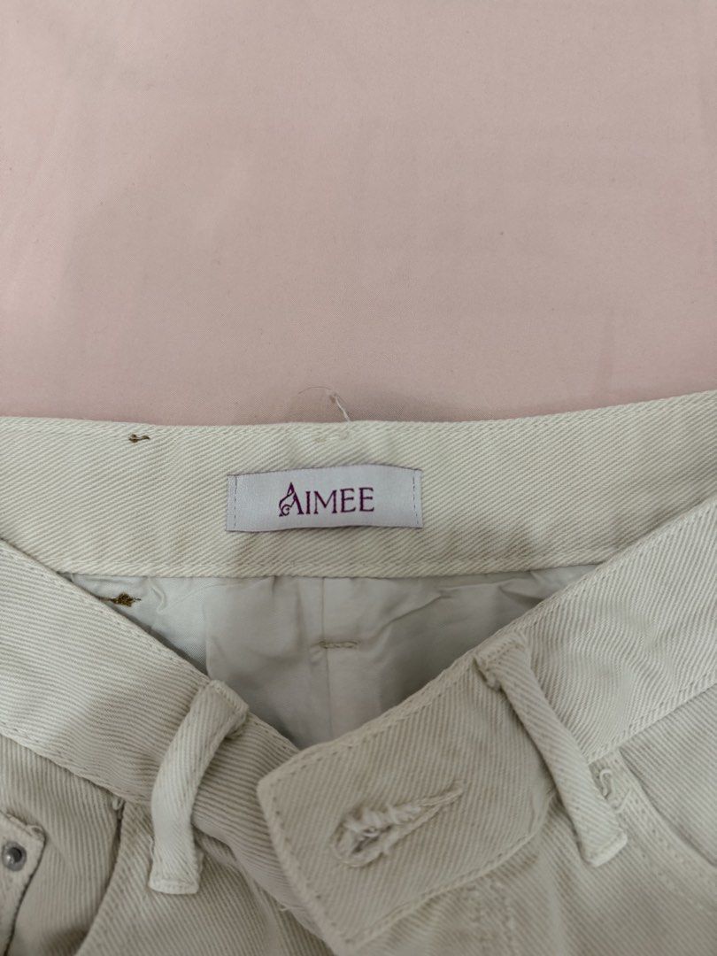 AIMEE Embellished Denim Mini Skirt (Category: Skirts) located in Tuguegarao City. Submitted by joysmithznjo (Listing ID 1461941692, Image 2). Description: - Cream denim mini skirt from AIMEE - Features all-over rhinestone embellishments on the hem - Classic five-pocket design - Zipper and button closure - Size: 160/68A (Medium) - Made in China - Perfect for versatile styling, dress up or down.