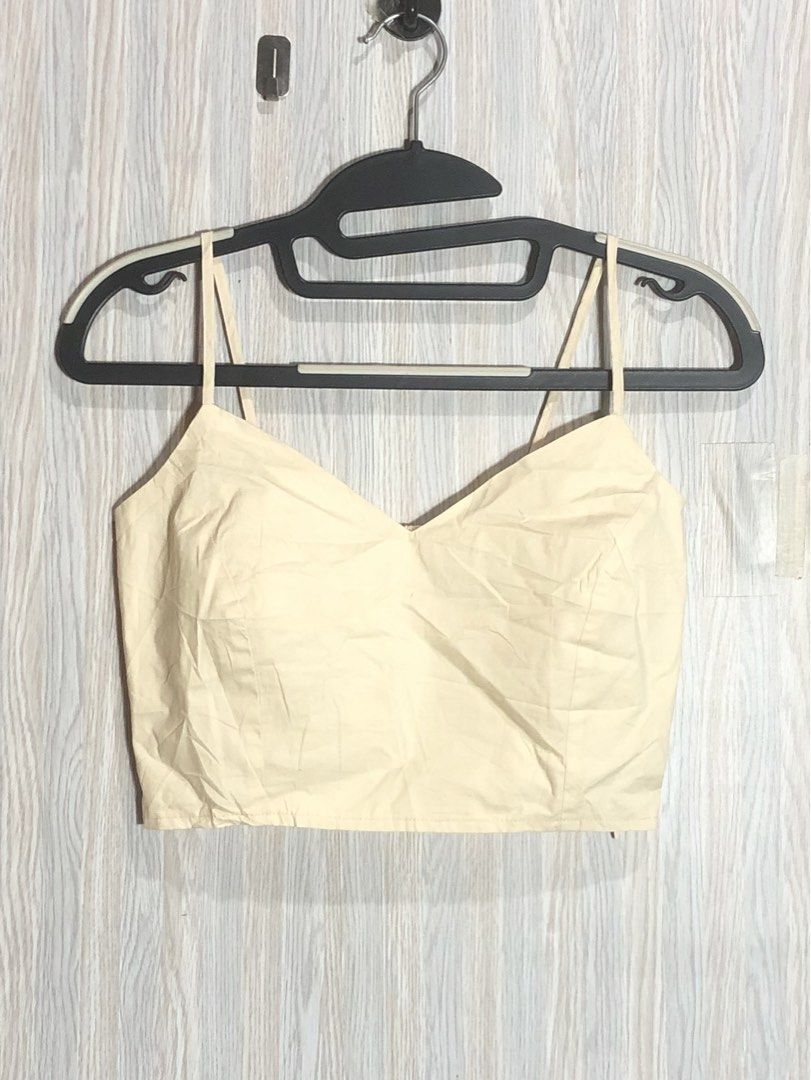 AIR SPACE Cream Smocked Back Crop Top Size M (Category: Sleeveless) located in Montevista. Submitted by rdthriftshub (Listing ID 1461909037, Image 1). Description: - Cream colored crop top from AIR SPACE - Size Medium - Smocked back for a comfortable fit - Adjustable spaghetti straps - V-neckline - Versatile for casual or dressed-up looks.