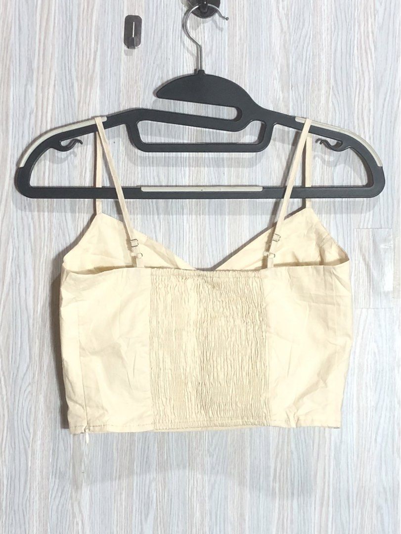 AIR SPACE Cream Smocked Back Crop Top Size M (Category: Sleeveless) located in Montevista. Submitted by rdthriftshub (Listing ID 1461909037, Image 2). Description: - Cream colored crop top from AIR SPACE - Size Medium - Smocked back for a comfortable fit - Adjustable spaghetti straps - V-neckline - Versatile for casual or dressed-up looks.