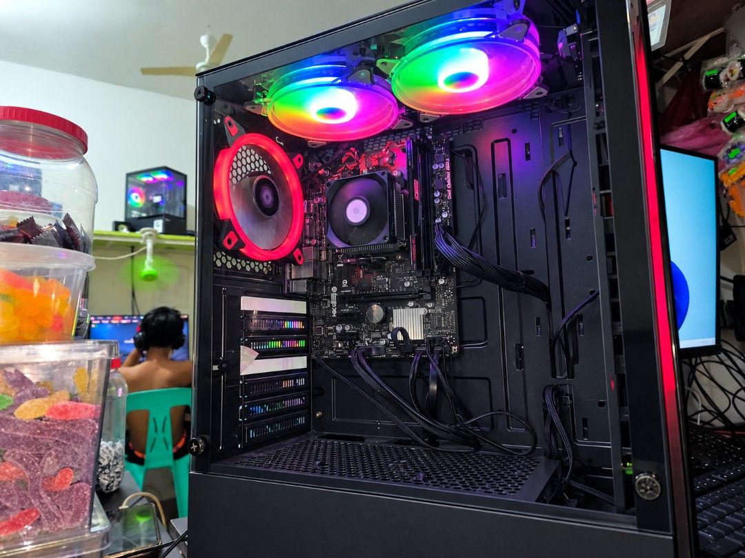 AMD Athlon 3000G gaming PC (Category: Desktops) located in Quezon City. Submitted by zantetsu (Listing ID 1461964656, Image 2). Description: A gaming desktop that is affordable and has no performance issues. Quick Specs: Processor: AMD Athlon 3000G With Radeon Hraphics RAM: 8gb (Upgradeable up to 64gb) Board: Biostar Storage: 120gb SSD + 500gb Hard disk Power Supply: 450 watts. Casing: Dual Glass cover Fans: 5 pcs LED Tested games: GTA 5 Crossfir