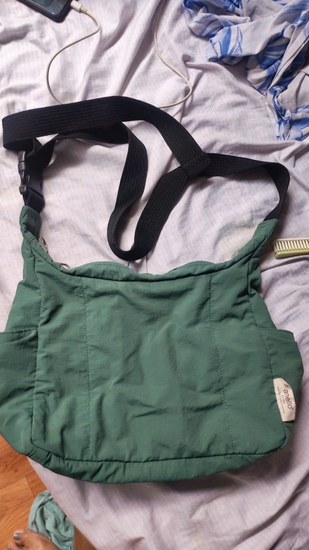 Anello Sling Bag Green (Category: Cross-body Bags) located in Manila. Submitted by lqndnm.lhen (Listing ID 1461821086, Image 1). Description: - Authentic Green Anello sling bag - Made in Japan - Spacious main compartment - Includes inner pockets for organization - Adjustable strap for comfortable wear - Ideal for everyday use - Please check photos for detailed condition.