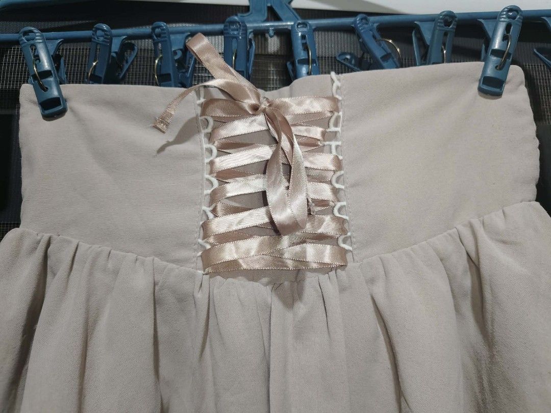 Ankrouge Corset Skirt (Category: Skirts) located in Caloocan City. Submitted by rafaelibarra (Listing ID 1461954110, Image 2). Description: - Cute Ankrouge skirt - Light beige fabric - Corset-style lace-up front with ribbon detail - Shirred waist at the back for a comfortable, adjustable fit - Perfect for both casual and dressed-up occasions.