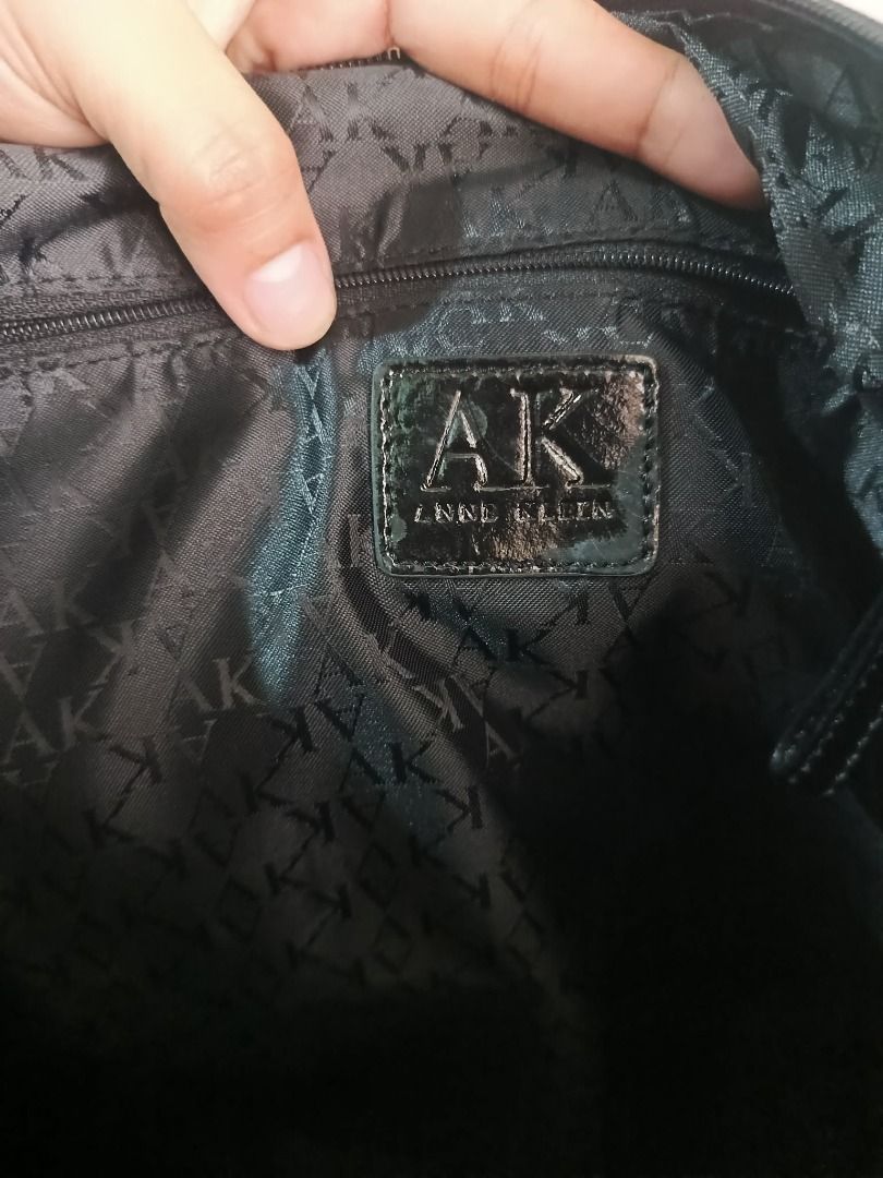 Anne Klein Black Croc Embossed Tote Bag (Category: Tote Bags) located in Caloocan City. Submitted by janeeh_007 (Listing ID 1461871380, Image 2). Description: - Stylish black tote bag - Luxurious croc-embossed texture - Shiny patent finish - Interior features Anne Klein logo - Ample space for your essentials - Durable, sturdy handles - Ideal for everyday wear.