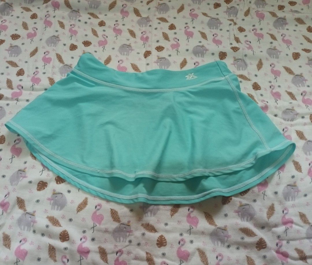 Aqua Athletic Skirt with Logo (Category: Skirts) located in Pasig City. Submitted by zeallion_149f0e (Listing ID 1461891101, Image 1). Description: - Aqua athletic skirt - Double-layered hem - Small logo on waistband - Ideal for sports or casual wear - Comfortable and lightweight material.