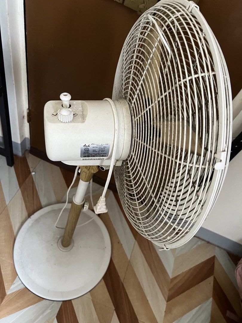 Asahi Stand Fan wooden design (Category: Fans) located in Dagupan City. Submitted by 2400forlife (Listing ID 1461823898, Image 3). Description: - Asahi Stand Fan - Model: XF-6077 - Size: 16 inches (405mm) - Power: 70 Watts, 230V, 60Hz - Safety Feature: Built-in thermal fuse - Adjustable height - In excellent working condition.
