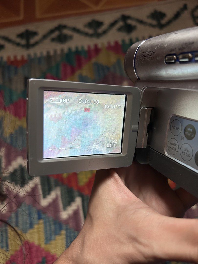 (Working with defects) Panasonic NV-DS60 MiniDV Camcorder (Category: Video Cameras) located in Pandi. Submitted by demmyyy (Listing ID 1461865047, Image 2). Description: 1k fixed ISSUE: * Cassette compartment -nagbblink then mag-ooff pag nilagyan ng tape * Screen burn * MiniDV playback not tested since it has a cassette issue Condition: * Powers on * Viewfinder still works but is physically sunken * Flash and Buttons working * Battery included Go