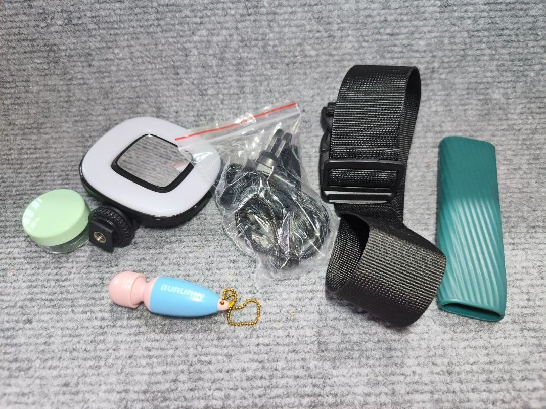 Assorted camera accesories with free keychain and small bottle (Category: Camera Bags & Carriers) located in San Leonardo. Submitted by burgossanleonardo.12345 (Listing ID 1461814048, Image 2). Description: Bundle of camera accesories Mirror Rubber handle Holder Etc.. .