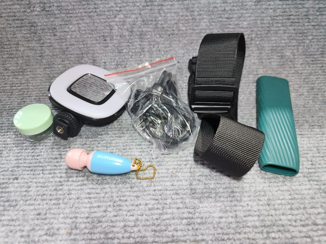 Assorted camera accesories with free keychain and small bottle (Category: Camera Bags & Carriers) located in San Leonardo. Submitted by burgossanleonardo.12345 (Listing ID 1461814048, Image 1). Description: Bundle of camera accesories Mirror Rubber handle Holder Etc.. .