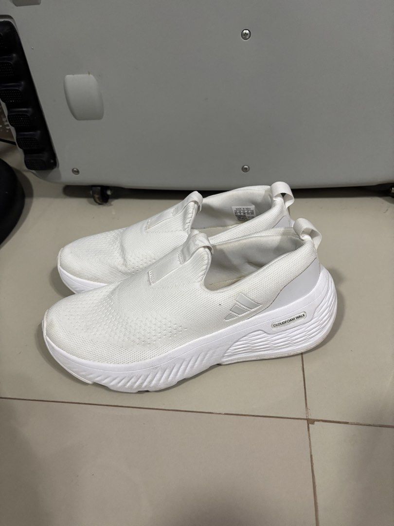 Authentic Adidas Cloudfoam Walk Slip-On Sneakers White (Category: Sneakers) located in Paranaque City. Submitted by emjayselltheirstuff (Listing ID 1461877960, Image 1). Description: - White Adidas slip-on sneakers -Size: US 6.5/UK 4.5 - Features Cloudfoam Comfort sole for excellent cushioning - Effortless slip-on design for easy wear - Perfect for everyday activities and casual outings.