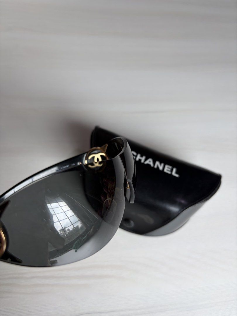 Authentic Chanel Black Sunglasses (Category: Luxury Accessories) located in Manila. Submitted by declutter_diariess (Listing ID 1462007780, Image 3). Description: Authentic, money back guarantee Gold hardware Very pretty Take note than this is vintage preloved. There are some scratches already on lens.