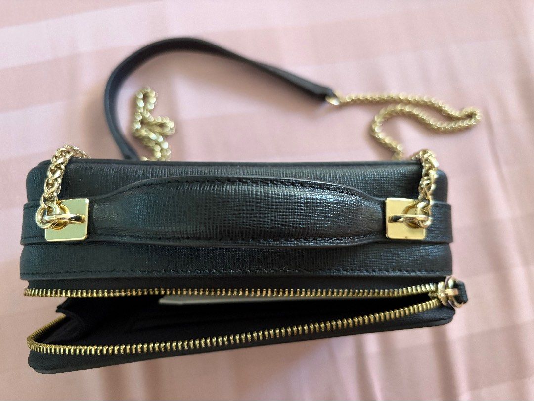 Authentic Furla (Category: Cross-body Bags) located in Quezon City. Submitted by smorata (Listing ID 1462028310, Image 2). Description: ✨ Brand: Furla 🖤 Color: Black 💛 Gold-tone chain strap with leather shoulder detail 📱 Compact phone/crossbody style ✨ Elegant saffiano-textured finish 10/10.