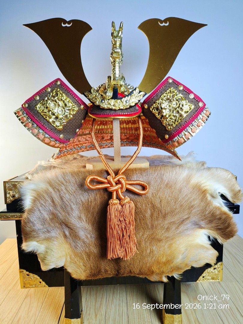 Authentic Japanese Kabuto Samurai Helmet (Museum-Quality Display) (Category: Other Home Decor) located in Pasay City. Submitted by onick_79 (Listing ID 1461995801, Image 2). Description: Highly detailed Japanese Samurai Kabuto display. Featuring an intricate golden dragon crest (maedate), traditional woven lacing, ornate brass hardware, and authentic fur trim, this centerpiece looks straight out of a museum gallery. Perfect for collectors, Japane