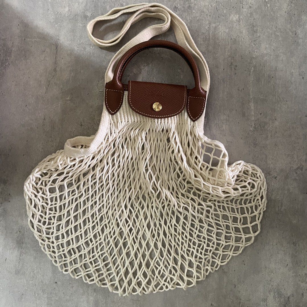 Authentic Original Longchamp Filet Large Net Tote Bag Ecru (Category: Luxury Bags & Wallets) located in General Trias. Submitted by abellu (Listing ID 1461869312, Image 1). Description: Selling to feed more bellies 🐾 Proceeds go to my rescue dogs, cats & strays. Please respect the price, no much haggling. Thank you - Authentic used once only - With Longchamp paperbag - Color: Ecru - Beige knit with brown leather handles and trim - Features class